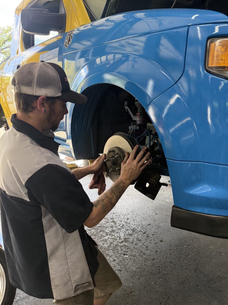 Technician performing brake repair at Campus Auto Repair in Fort Collins
